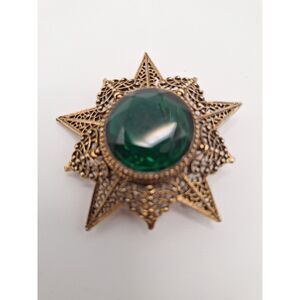 Vintage brooch Arthur Pepper faceted green glass eight point filigree star